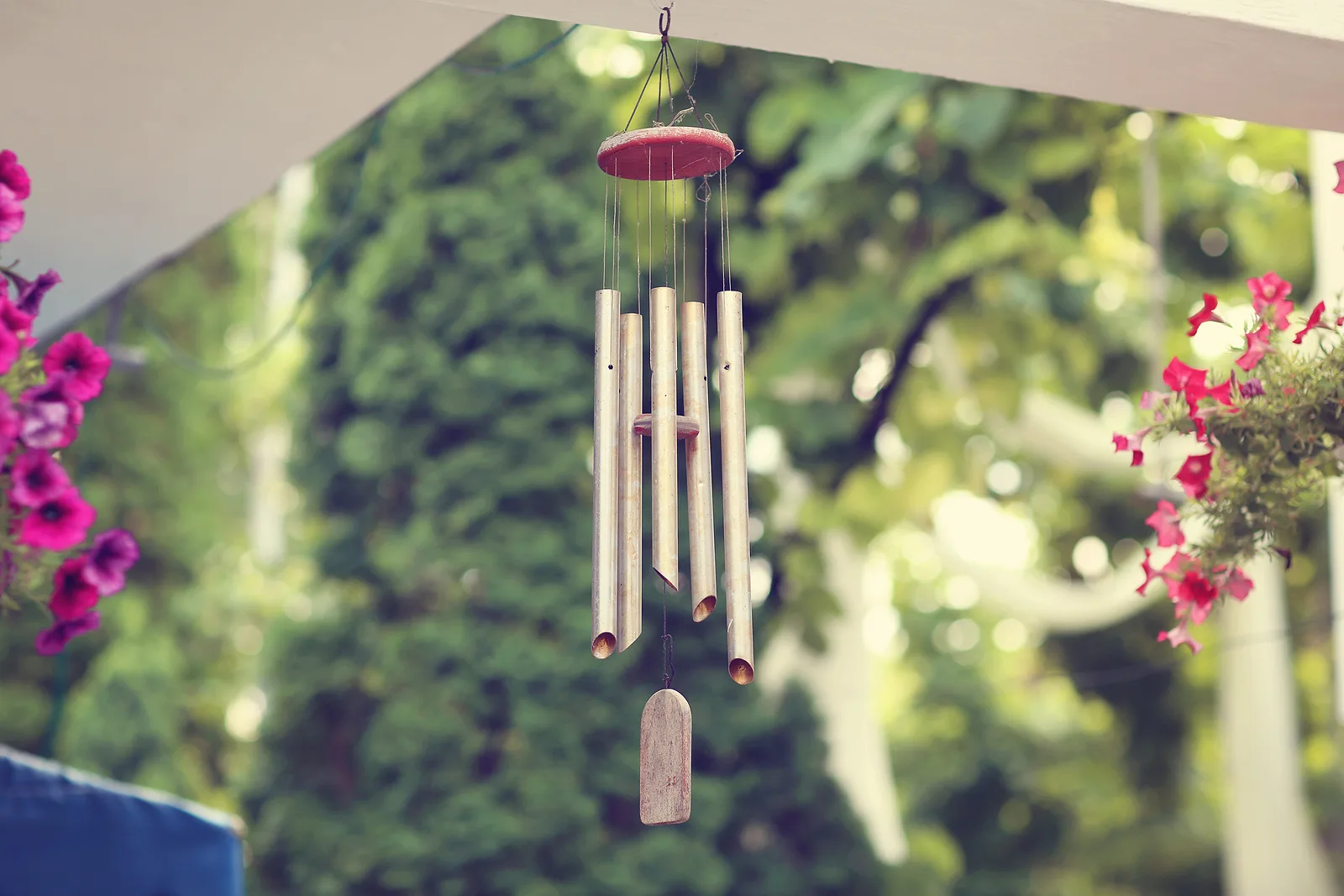 Metal wind chimes on a porch, a mild sound deterrent