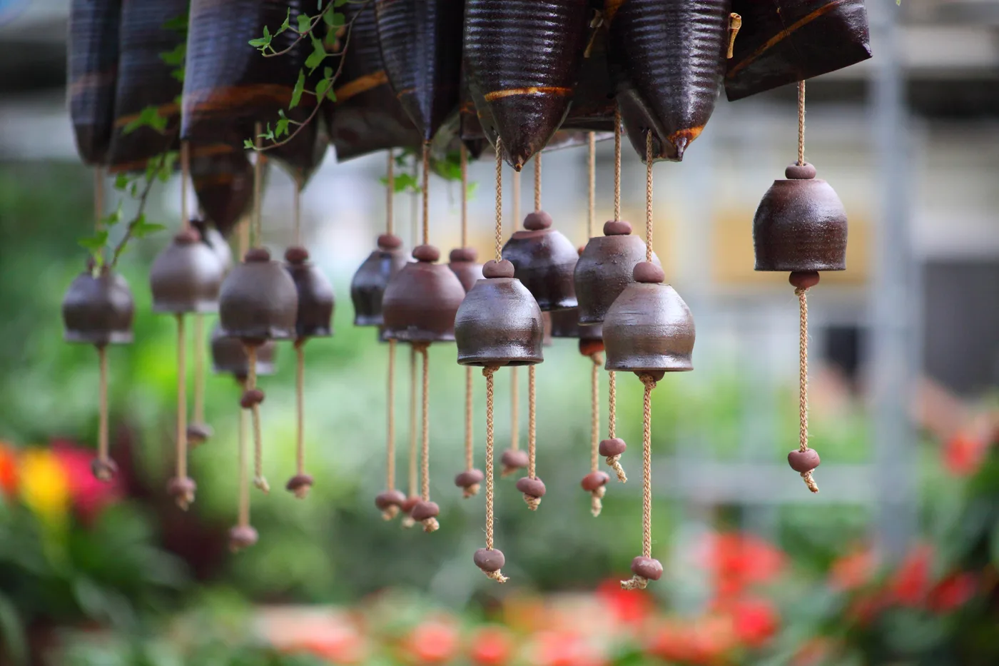 Wind chimes hanging in a garden as a bird deterrent